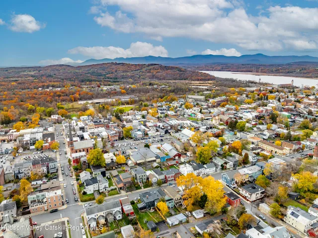 an aerial view of residential houses with outdoor space