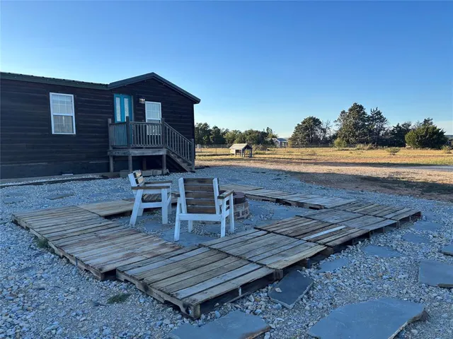 a wooden bench sitting on top of a wooden floor