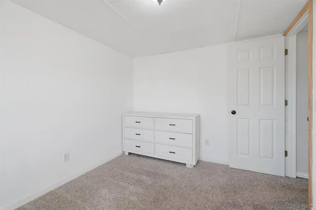 a room with a dresser in it
