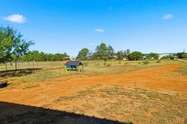 a view of an ocean and a yard
