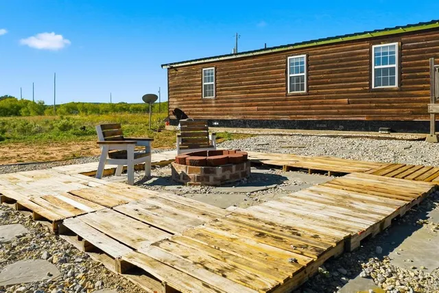 a view of a lounge chairs on the deck