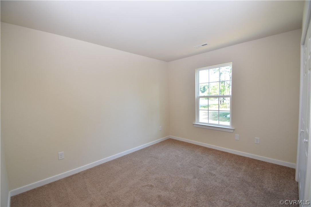 2435 Meadow Road Sandston, VA 23150 - Photo 11 of 14 an empty room with a window