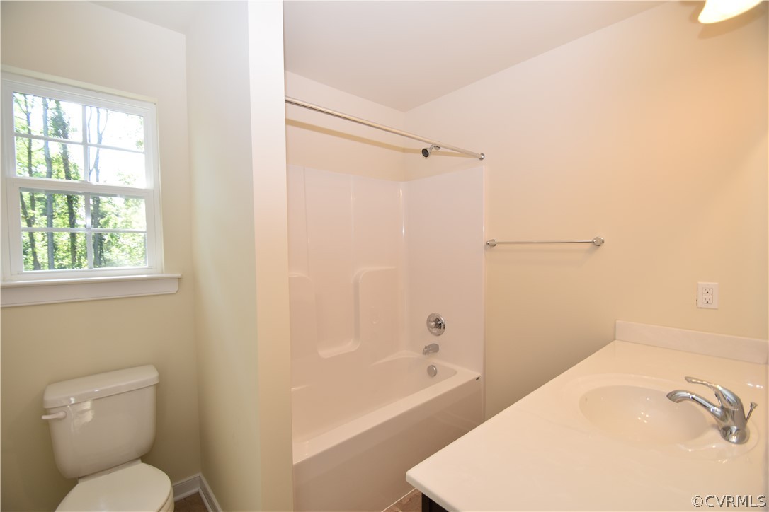 2435 Meadow Road Sandston, VA 23150 - Photo 12 of 14 a bathroom with a sink and a toilet