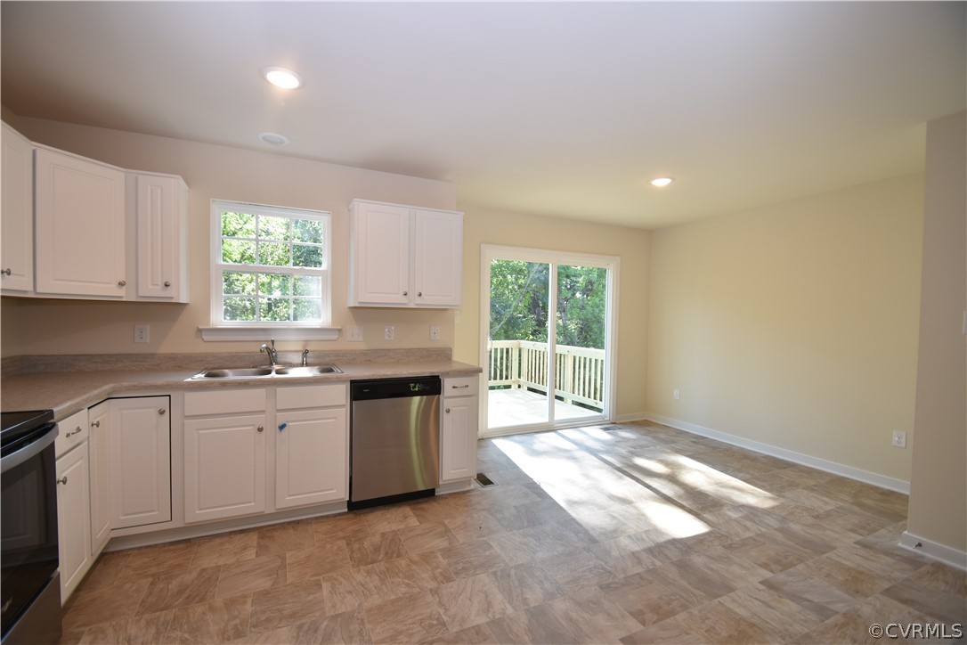 2435 Meadow Road Sandston, VA 23150 - Photo 4 of 14 a kitchen with a stove a sink and a refrigerator