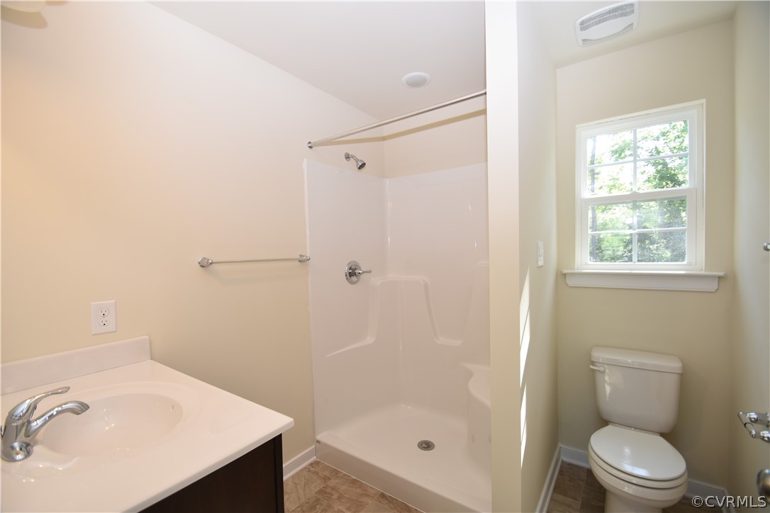 2435 Meadow Road Sandston, VA 23150 - Photo 9 of 14 a bathroom with a sink and a shower