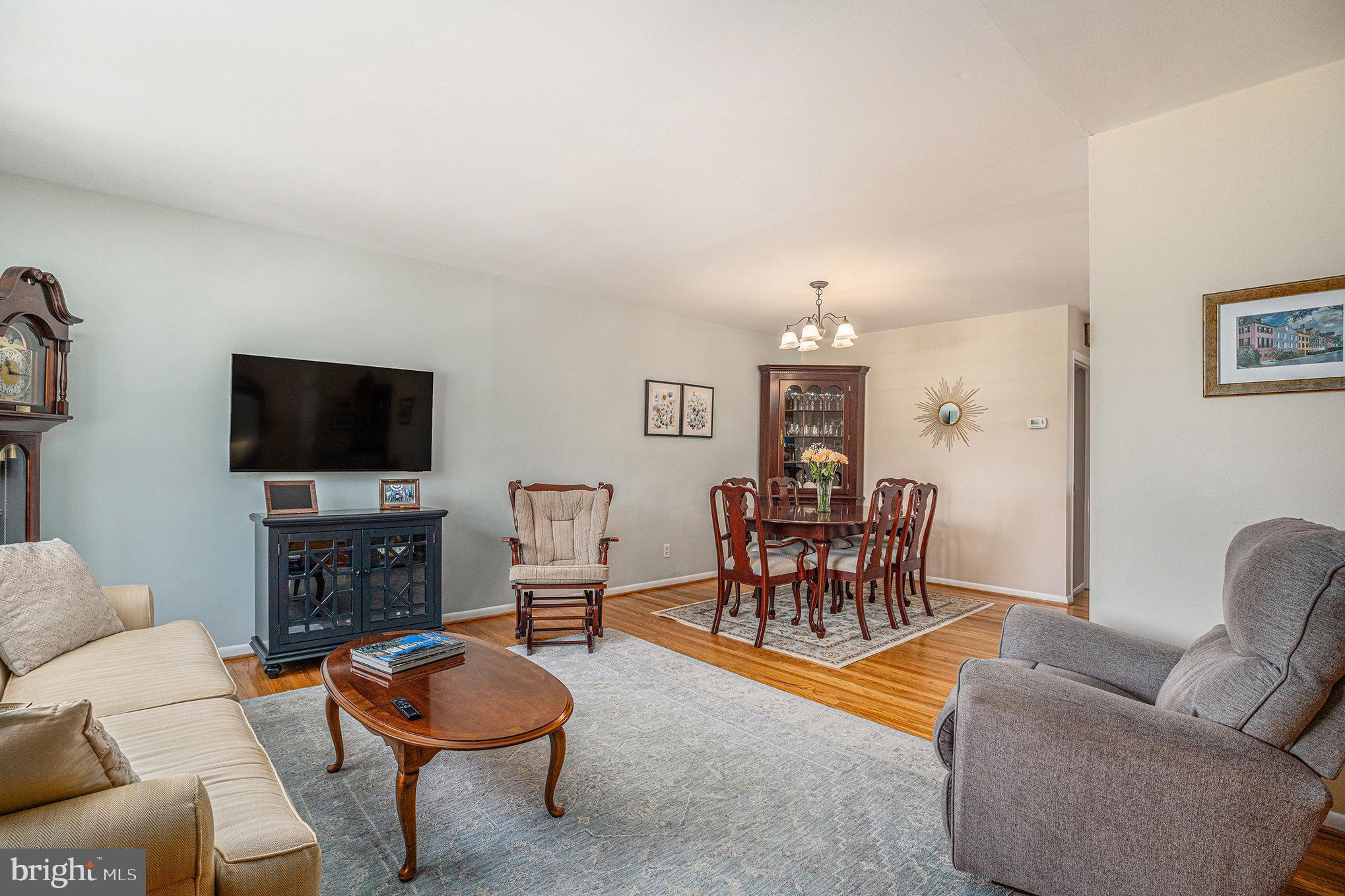 13027 Stevens Road Philadelphia, PA 19116 - Photo 7 of 39 a living room with furniture a flat screen tv and kitchen view