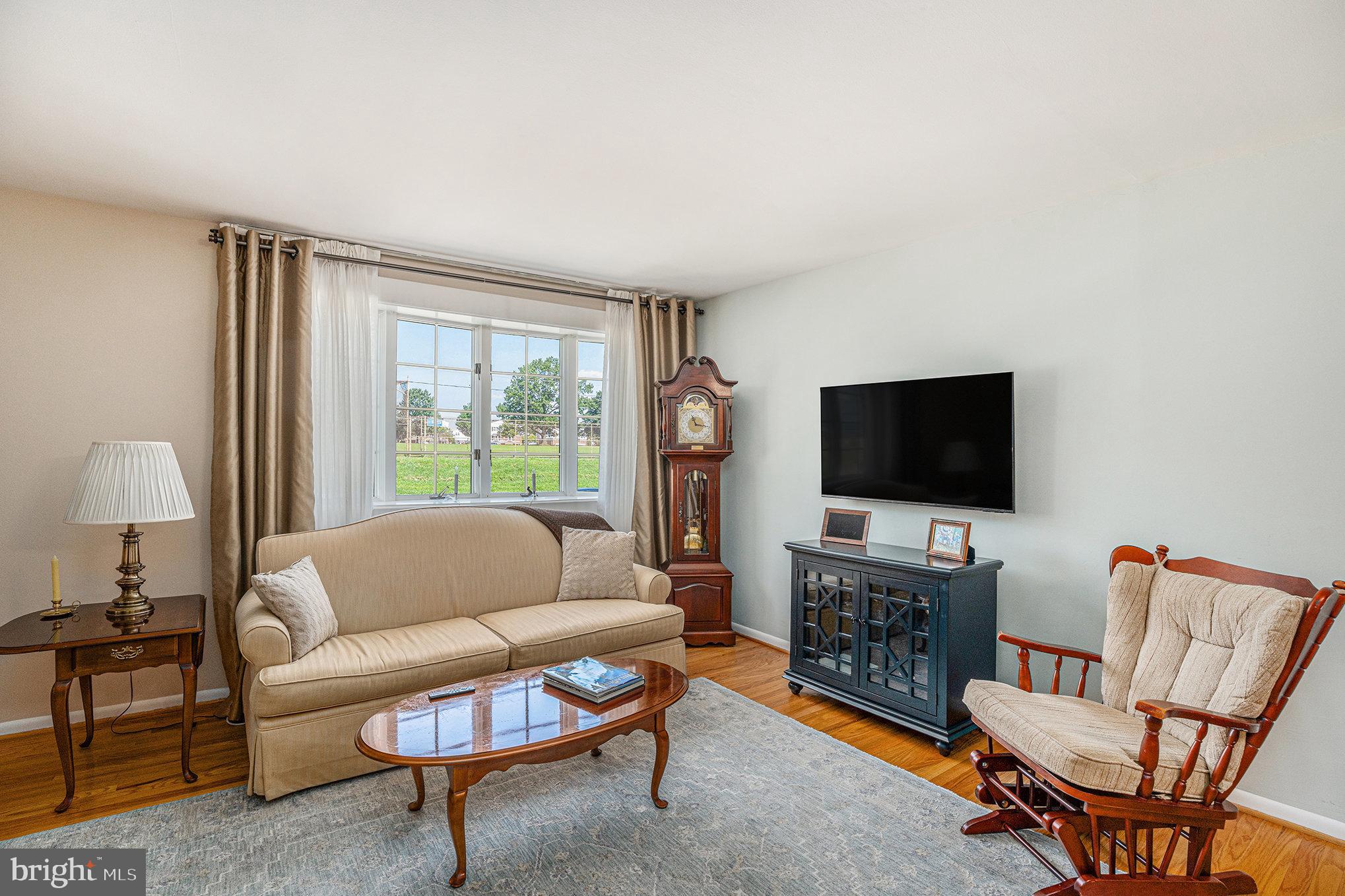 13027 Stevens Road Philadelphia, PA 19116 - Photo 8 of 39 a living room with furniture and a flat screen tv