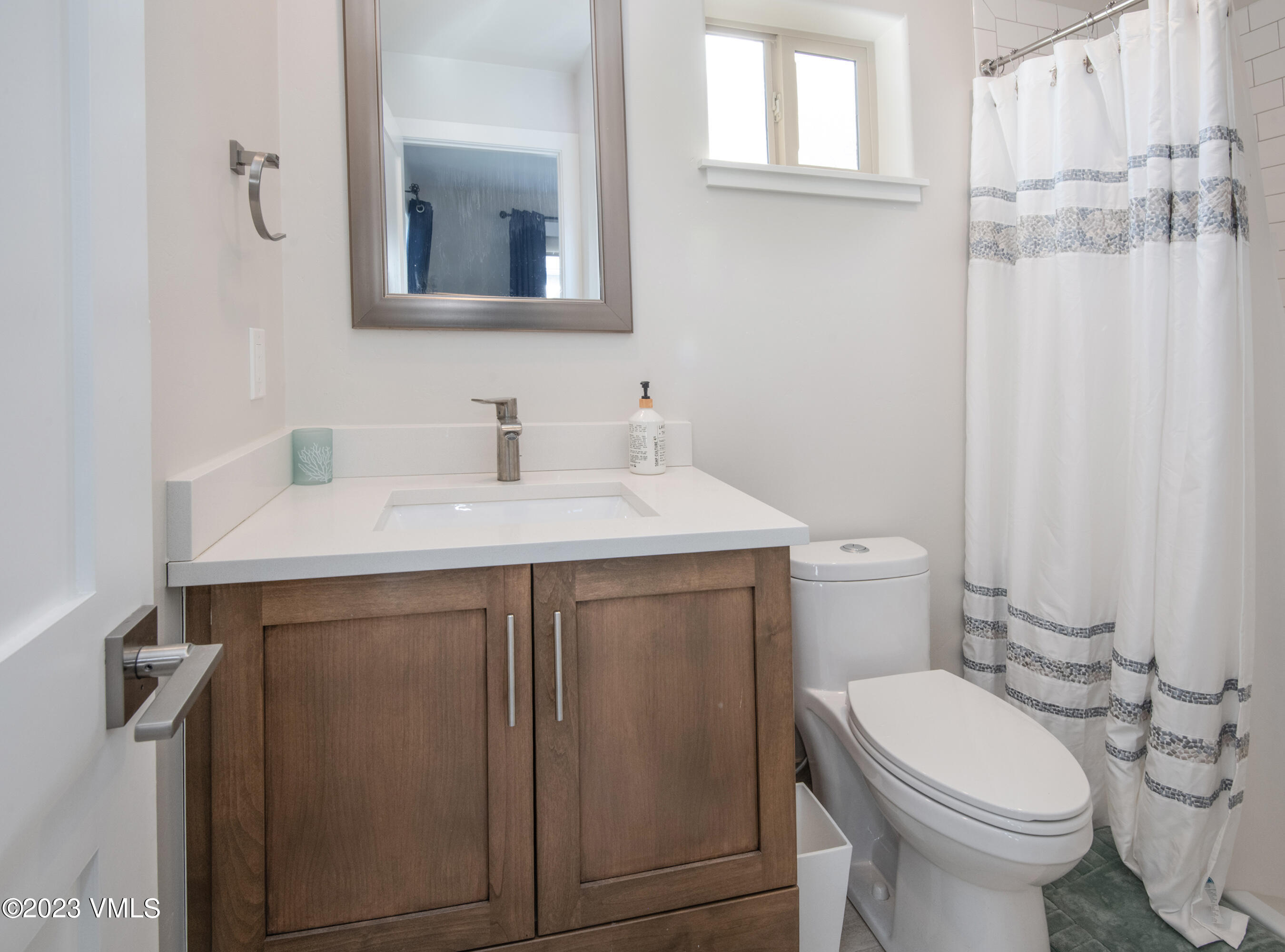 316 Wall Street, Unit 8 Eagle, CO 81631 - Photo 12 of 19 a bathroom with a sink vanity mirror and toilet