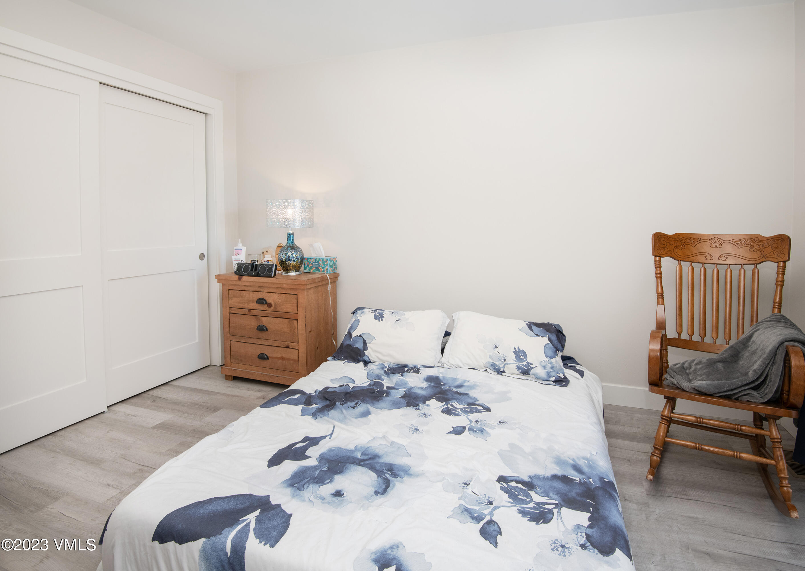 316 Wall Street, Unit 8 Eagle, CO 81631 - Photo 13 of 19 a bed sitting in a bedroom and chair