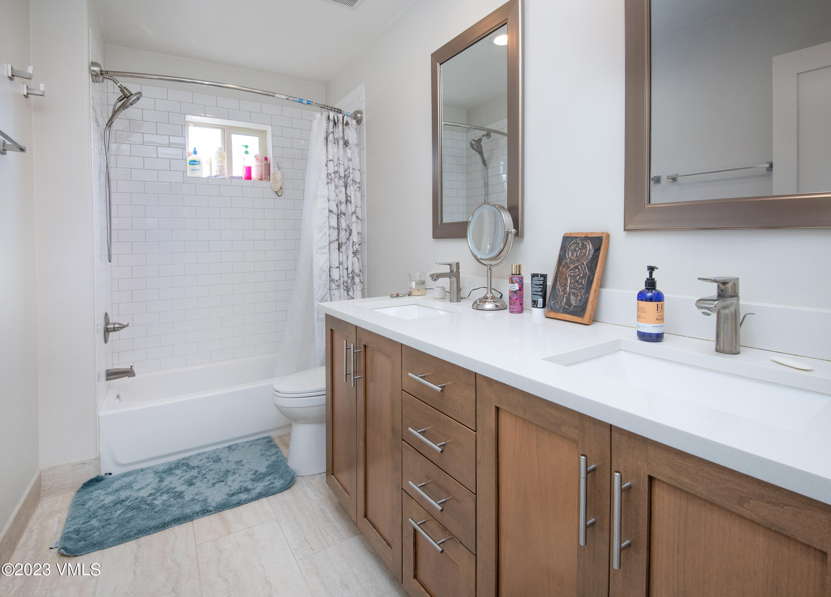 316 Wall Street, Unit 8 Eagle, CO 81631 - Photo 15 of 19 a bathroom with a tub sink and mirror
