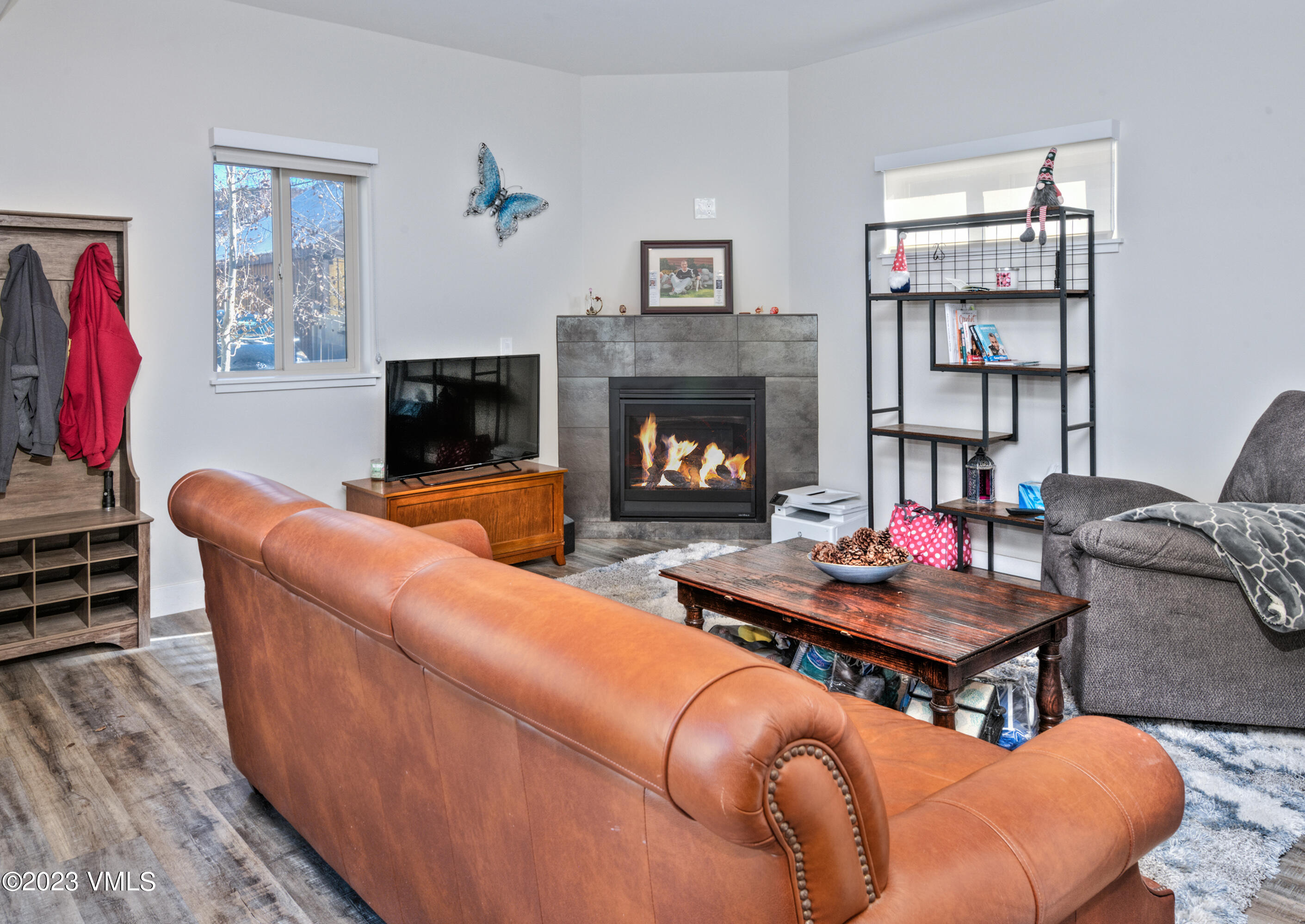 316 Wall Street, Unit 8 Eagle, CO 81631 - Photo 2 of 19 a living room with furniture a flat screen tv and a fireplace