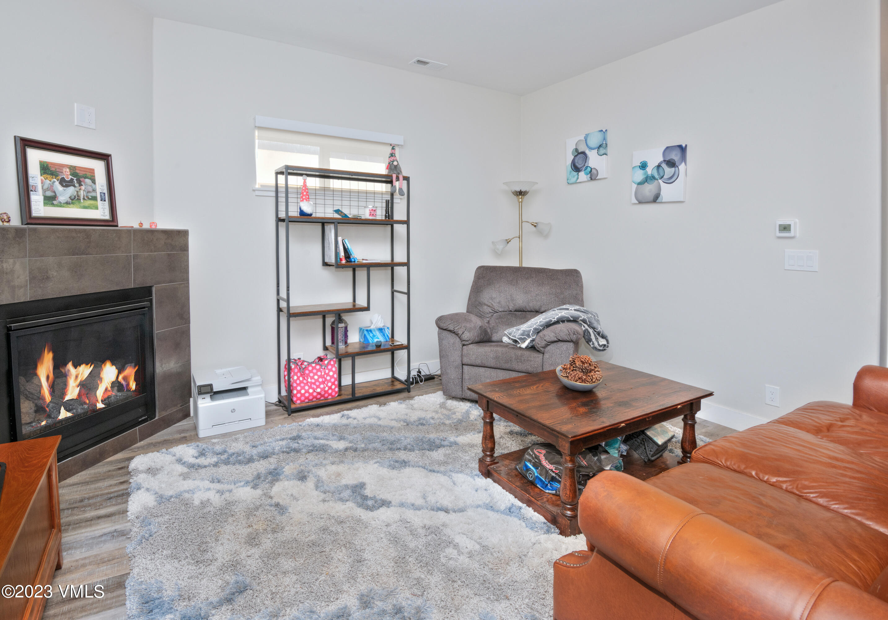 316 Wall Street, Unit 8 Eagle, CO 81631 - Photo 3 of 19 a living room with furniture a window and a fireplace