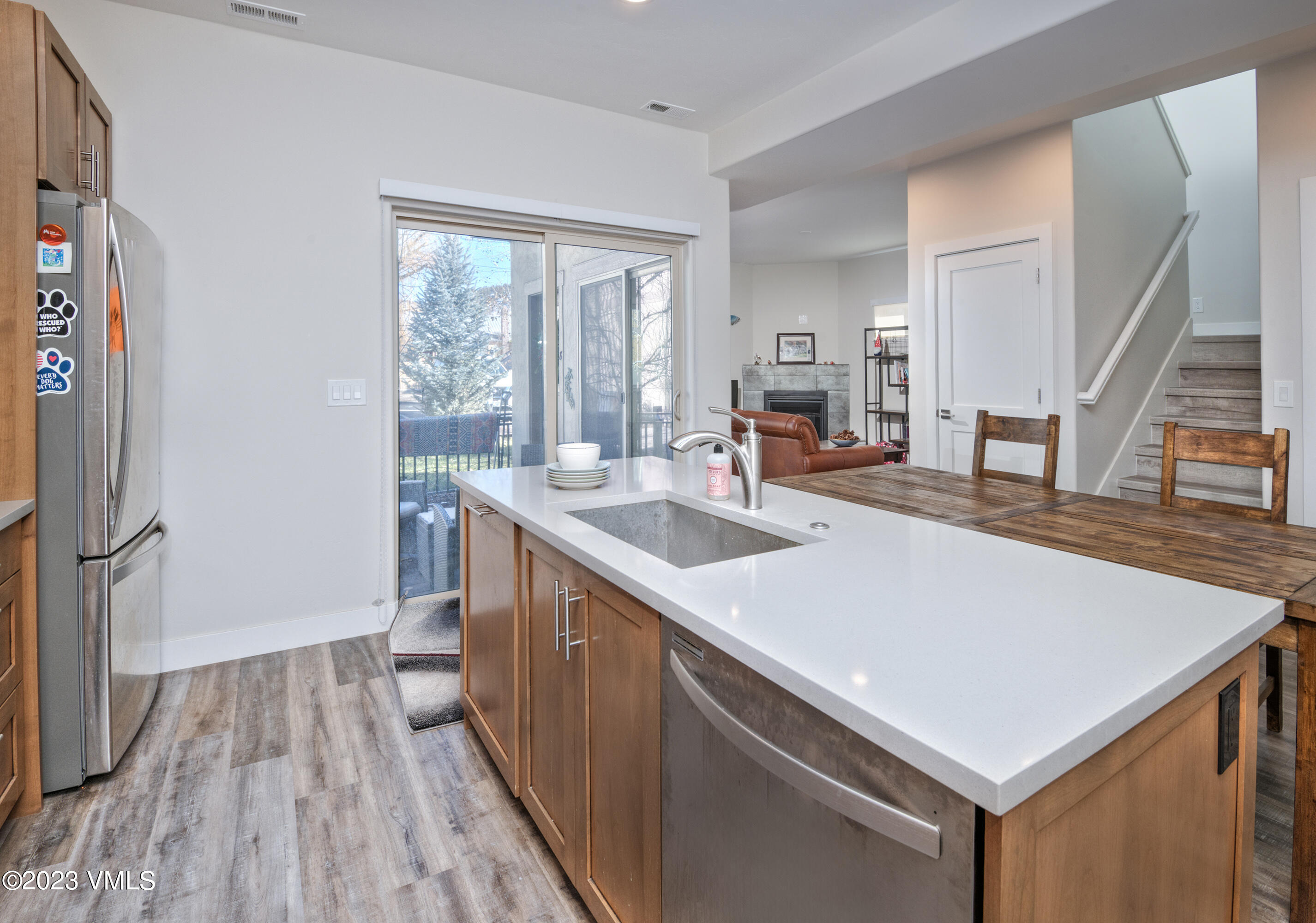 316 Wall Street, Unit 8 Eagle, CO 81631 - Photo 7 of 19 a kitchen with wooden cabinets a sink and wooden floor