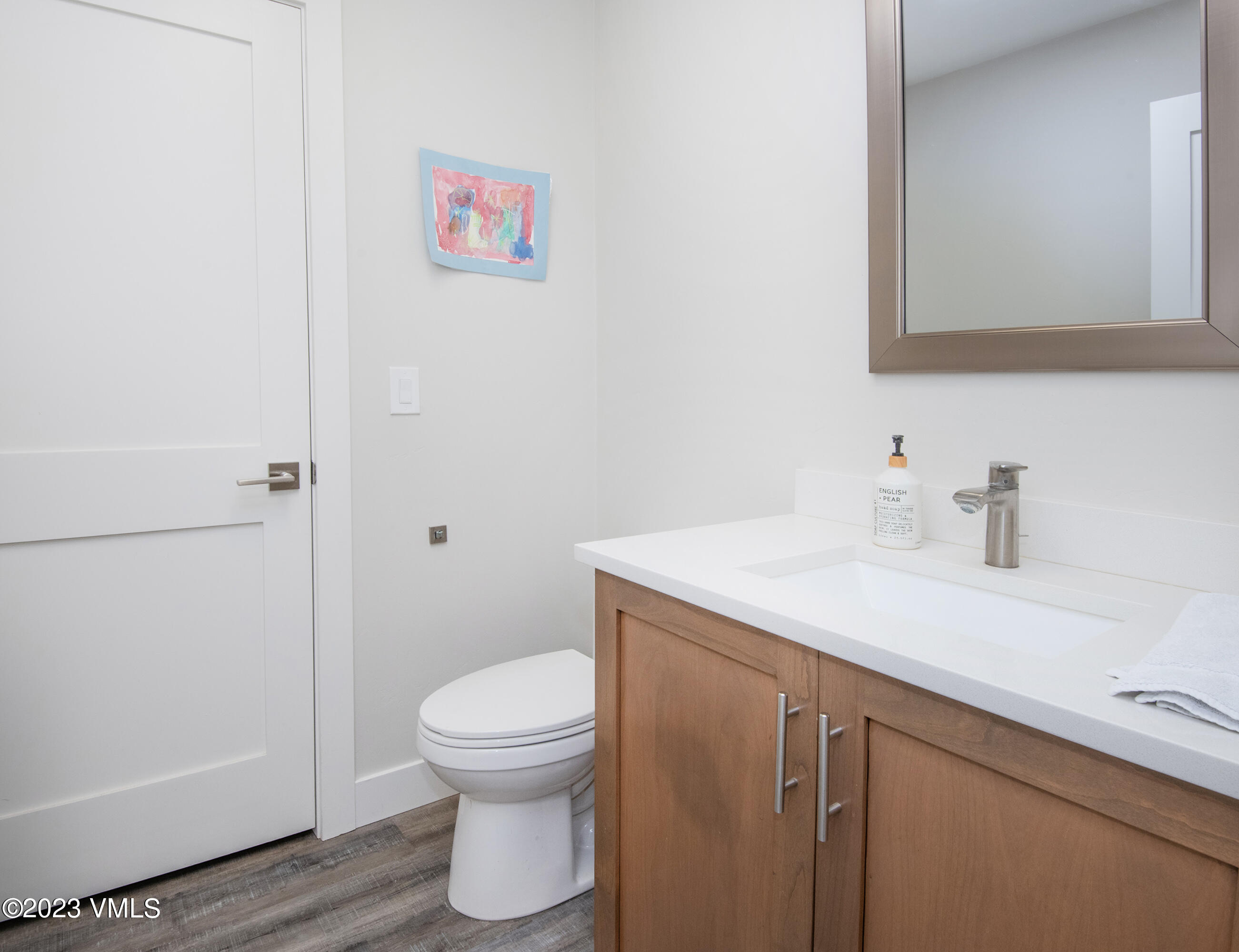 316 Wall Street, Unit 8 Eagle, CO 81631 - Photo 9 of 19 a bathroom with a sink a toilet and a mirror