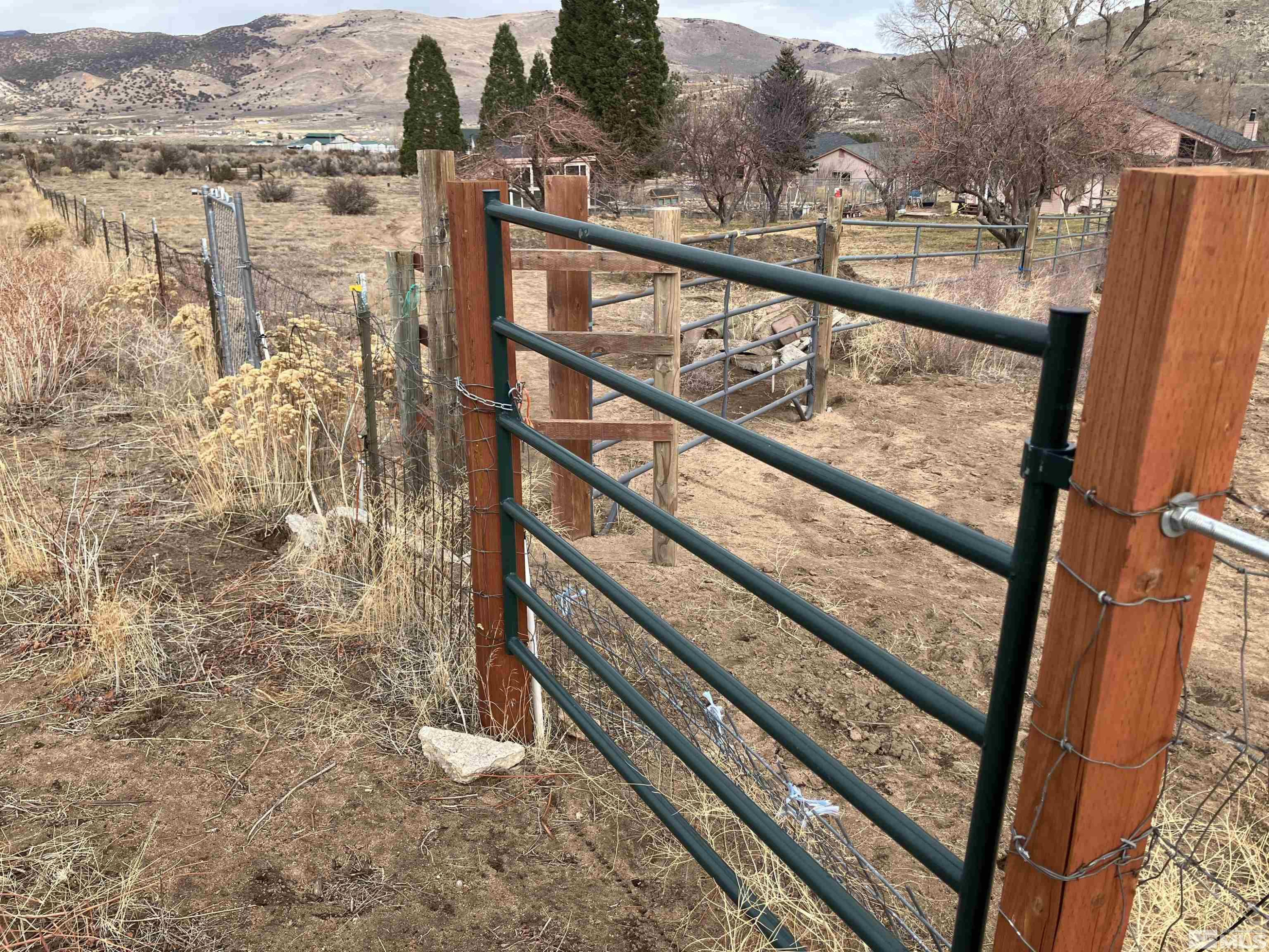 85 Appaloosa Circle Reno, NV 89508 - Photo 11 of 15 a view of a balcony with wooden floor and lake view