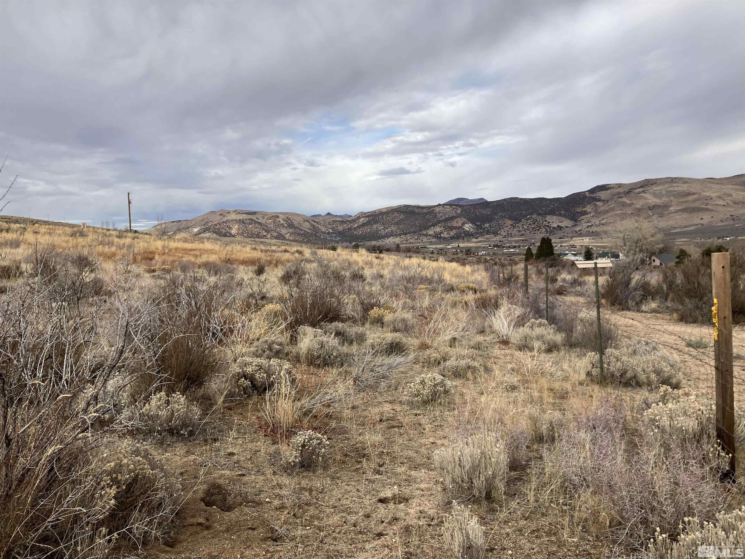 85 Appaloosa Circle Reno, NV 89508 - Photo 12 of 15 a view of a dry yard with mountains and green space