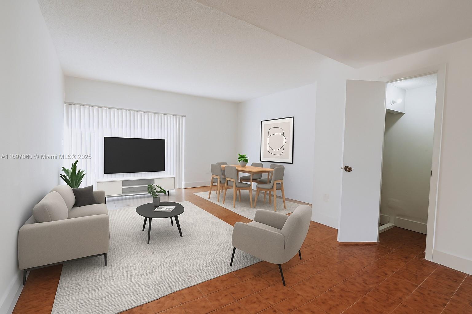 3791 Northwest 78th Avenue, Unit 24 Davie, FL 33024 - Photo 1 of 22 a living room with furniture and a flat screen tv