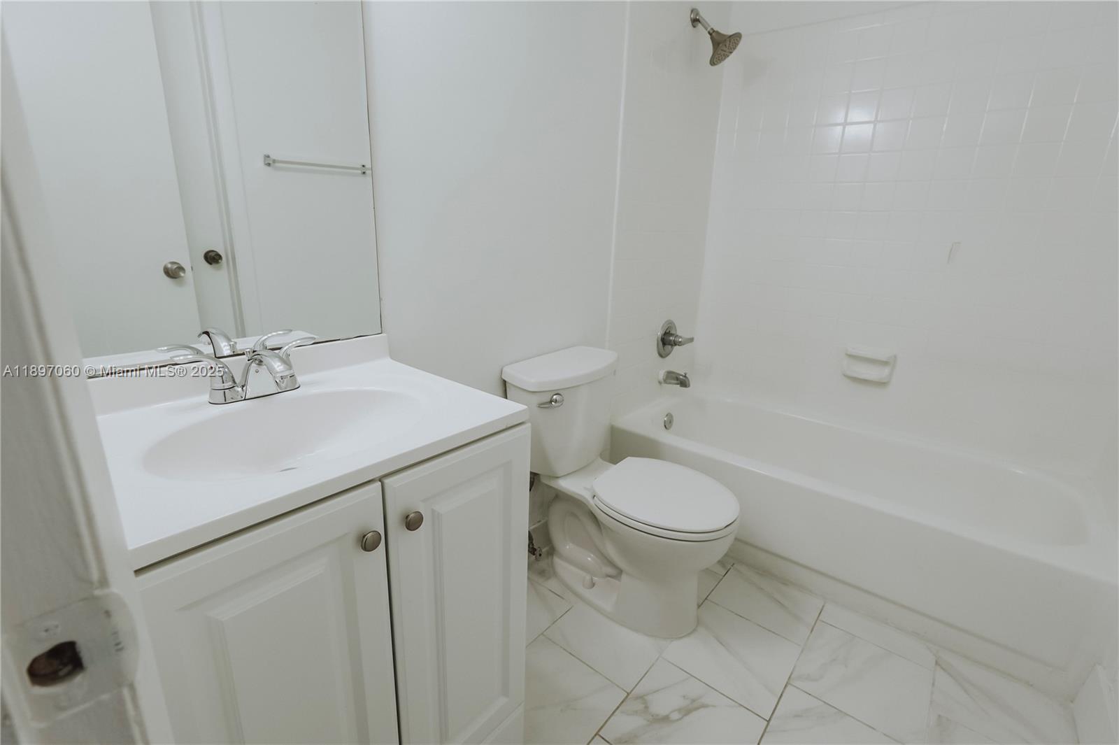 3791 Northwest 78th Avenue, Unit 24 Davie, FL 33024 - Photo 19 of 22 a bathroom with a sink a toilet and shower