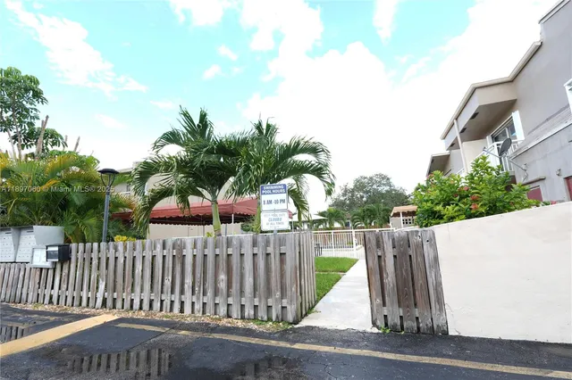 a view of street with wooden fence