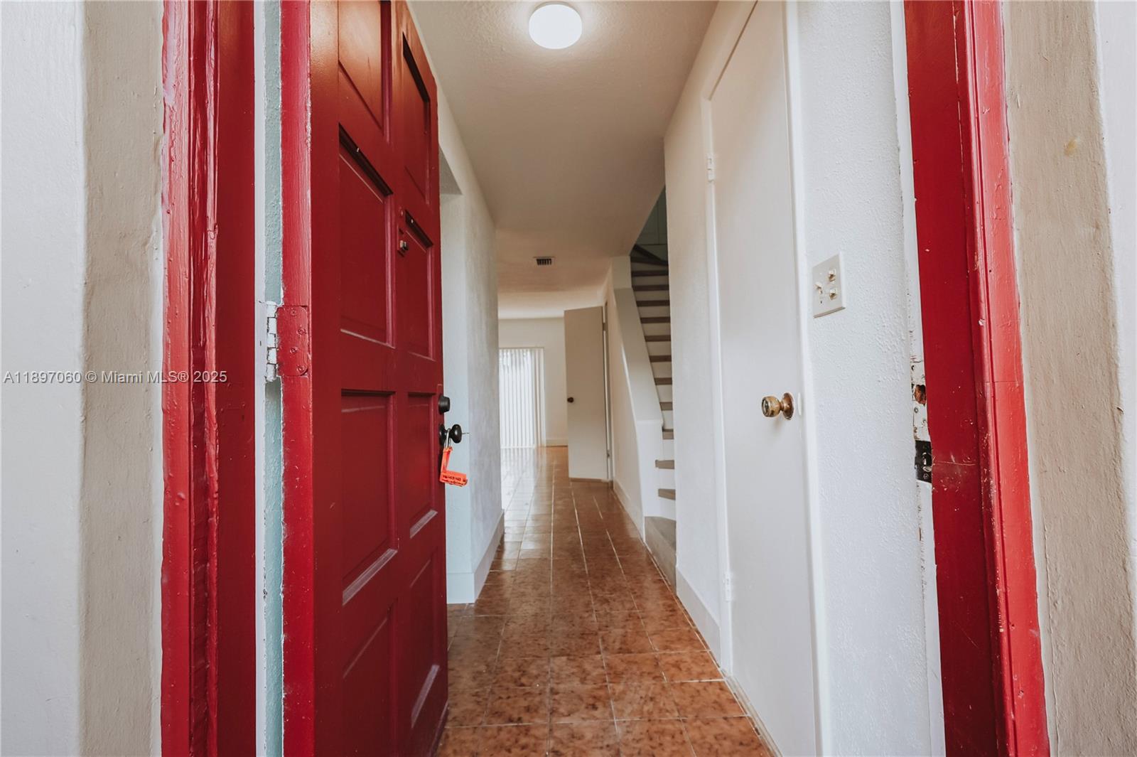 3791 Northwest 78th Avenue, Unit 24 Davie, FL 33024 - Photo 7 of 22 a view of a hallway with a elevator