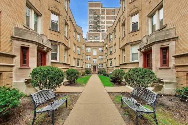 a view of a brick building next to a brick building