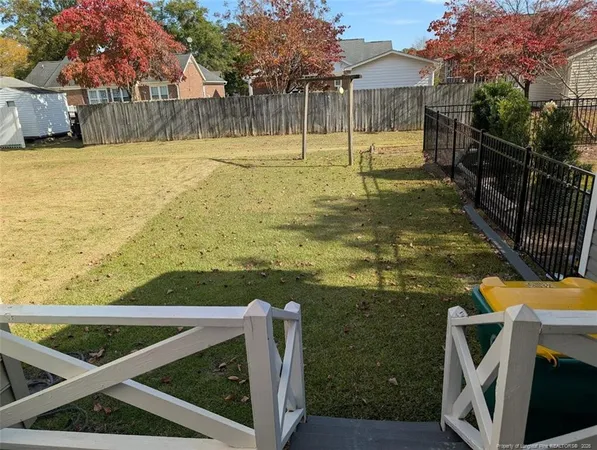a view of a patio with a yard