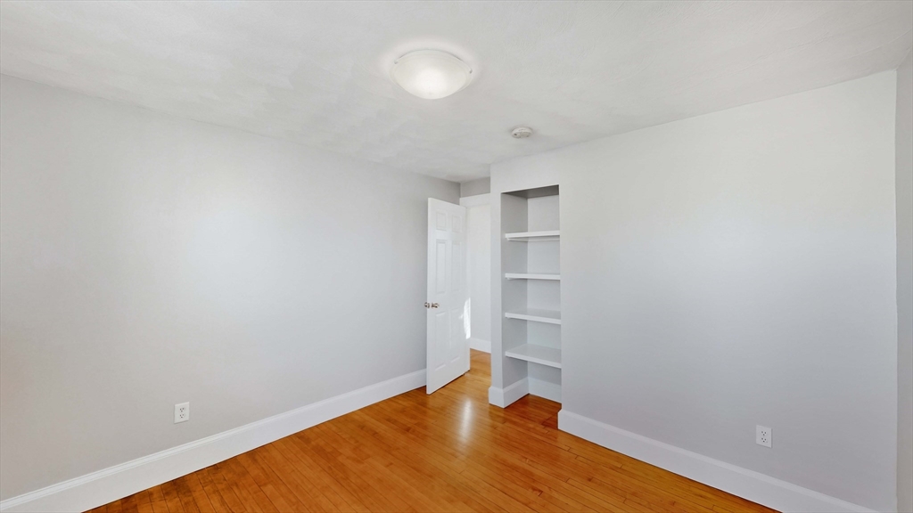 40-42 Upham Street, Unit 1 Malden, MA 02148 - Photo 9 of 17 a view of empty room with wooden floor