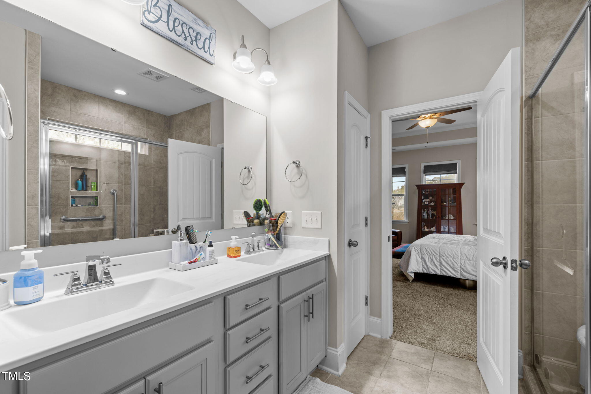 901 Peterson Ridge Road Fuquay-Varina, NC 27526 - Photo 11 of 23 a en suite bathroom with double sink and a mirror