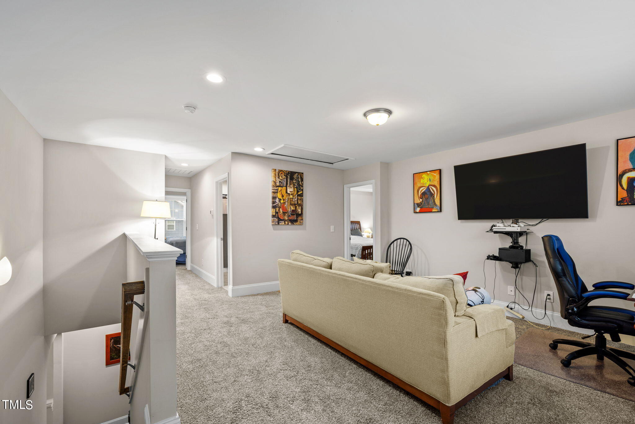 901 Peterson Ridge Road Fuquay-Varina, NC 27526 - Photo 13 of 23 a living room with furniture and a flat screen tv