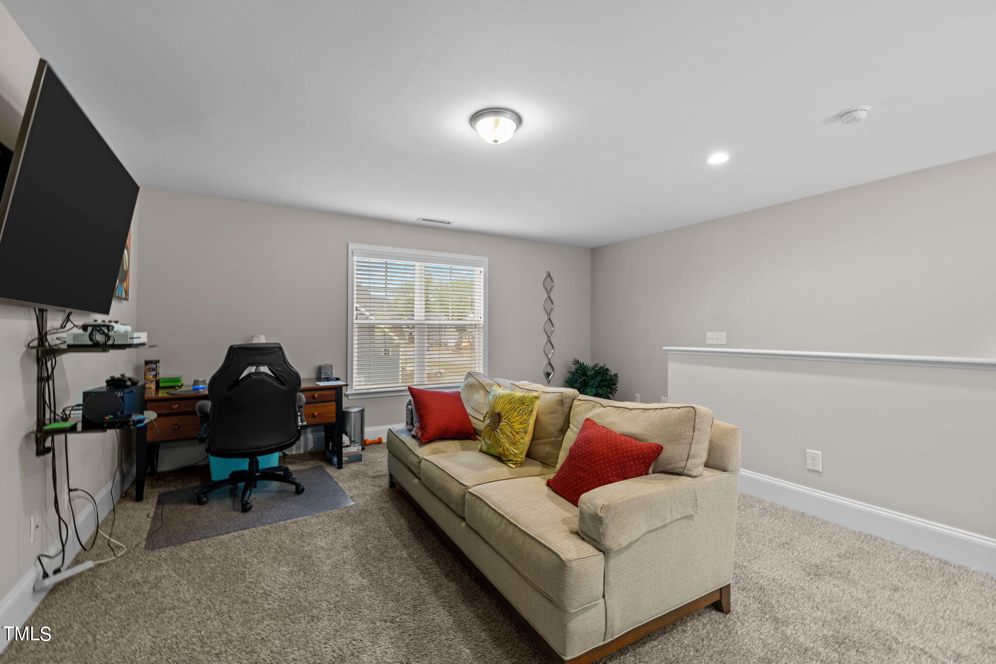 901 Peterson Ridge Road Fuquay-Varina, NC 27526 - Photo 14 of 23 a living room with furniture a flat screen tv and a window