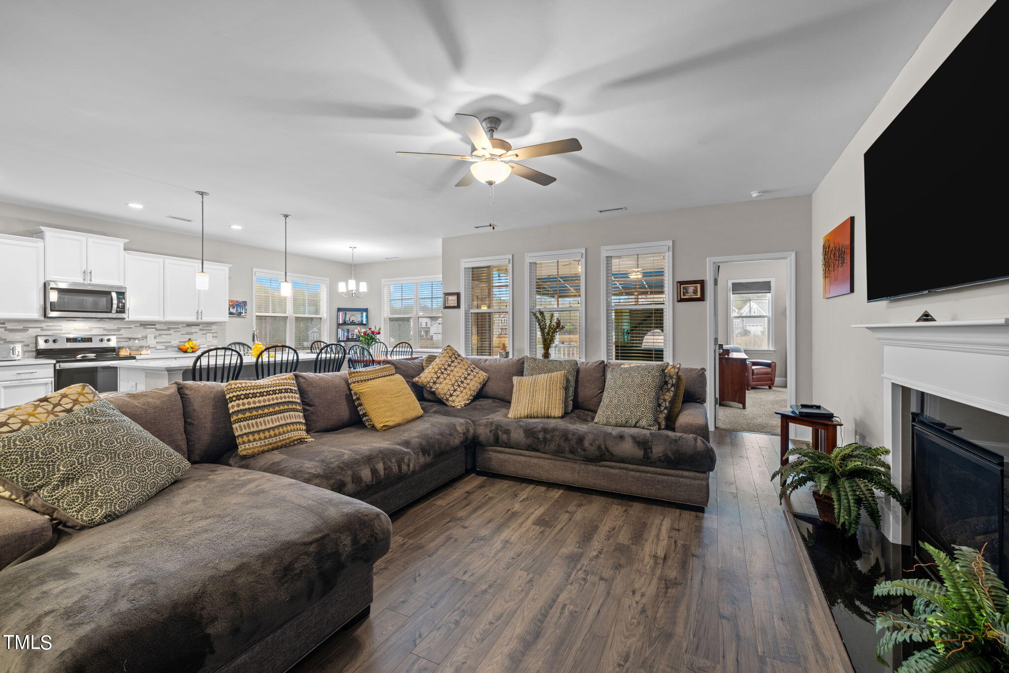 901 Peterson Ridge Road Fuquay-Varina, NC 27526 - Photo 7 of 23 a living room with fireplace furniture and a flat screen tv