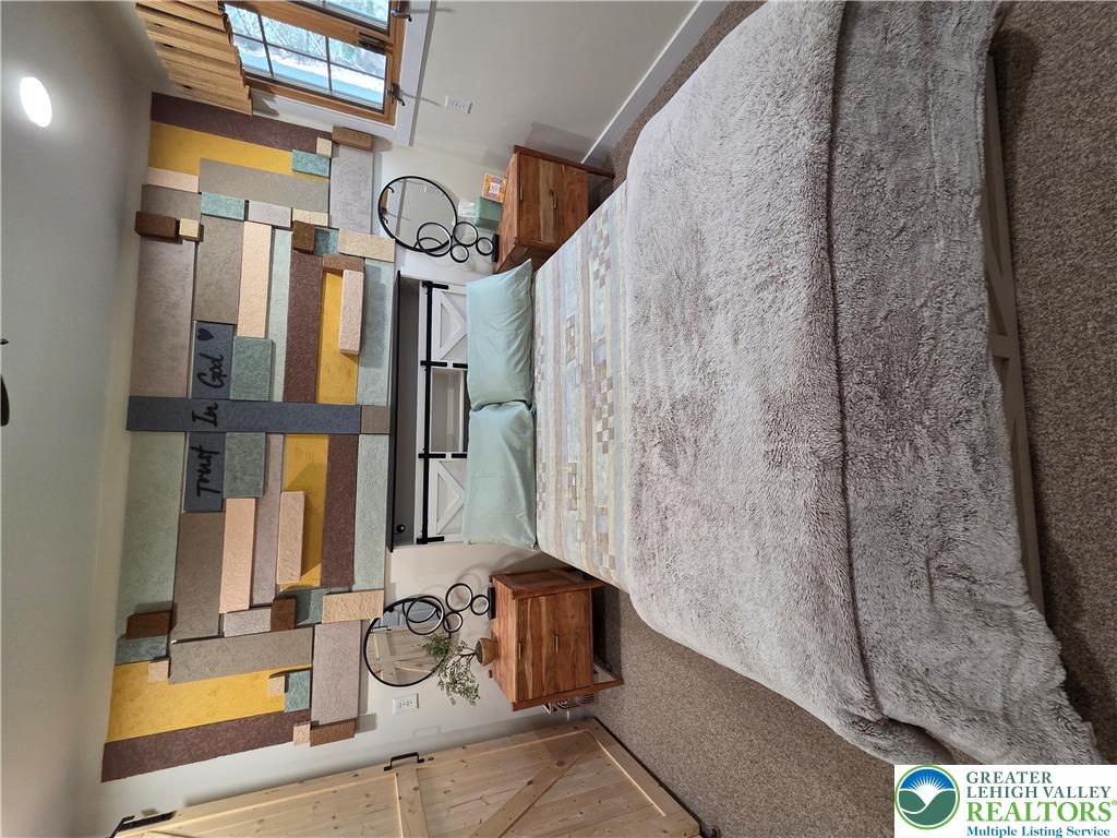 89 Short Ridge Road Albrightsville, PA 18210 - Photo 29 of 71 Plush carpeting and textured wall finishes create a cozy atmosphere in this bedroom.