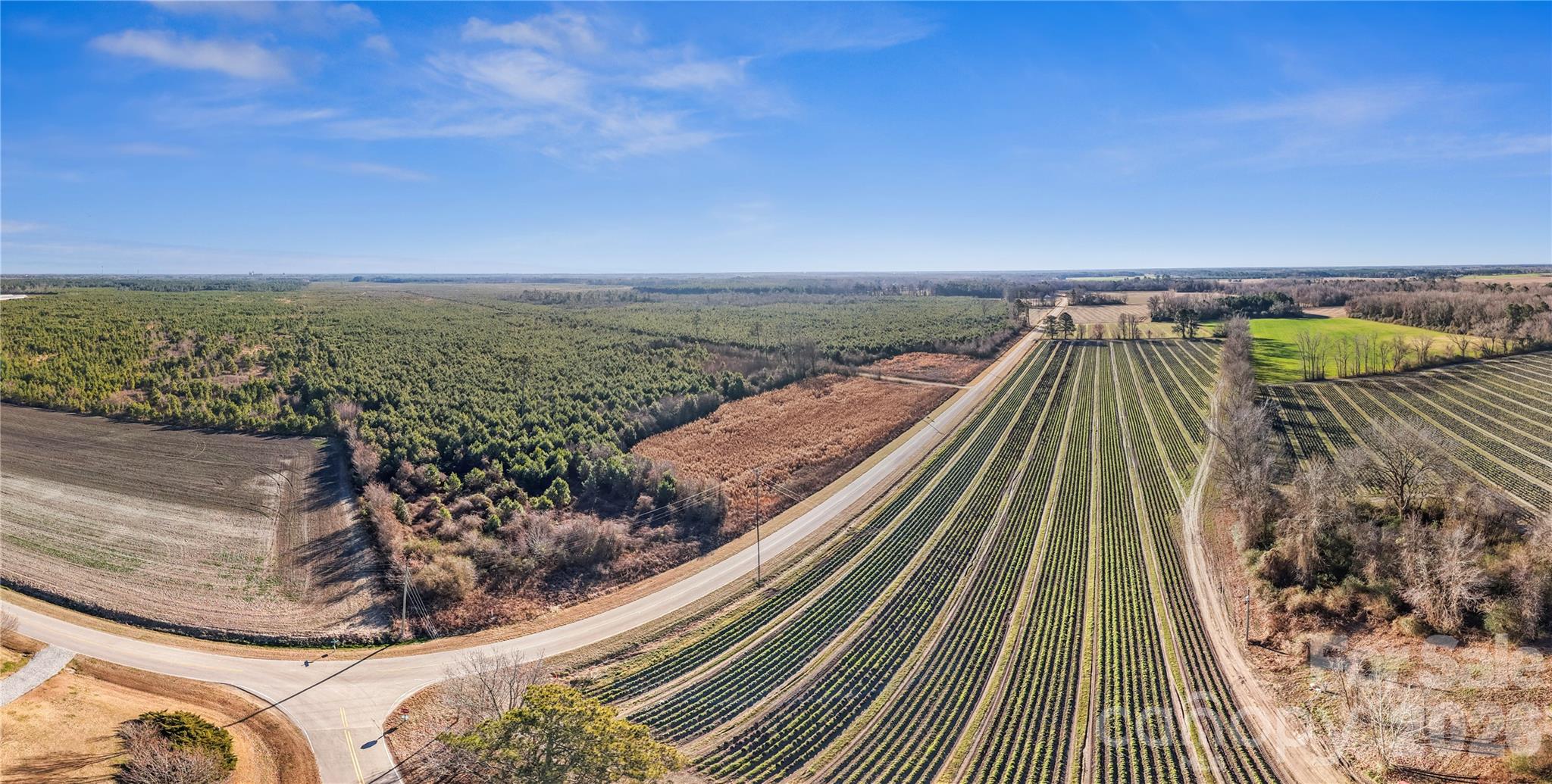700-ac Earl Davis Road Rose Hill, NC 28458 - Photo 21 of 35 a view of a large body of water with a building in the background