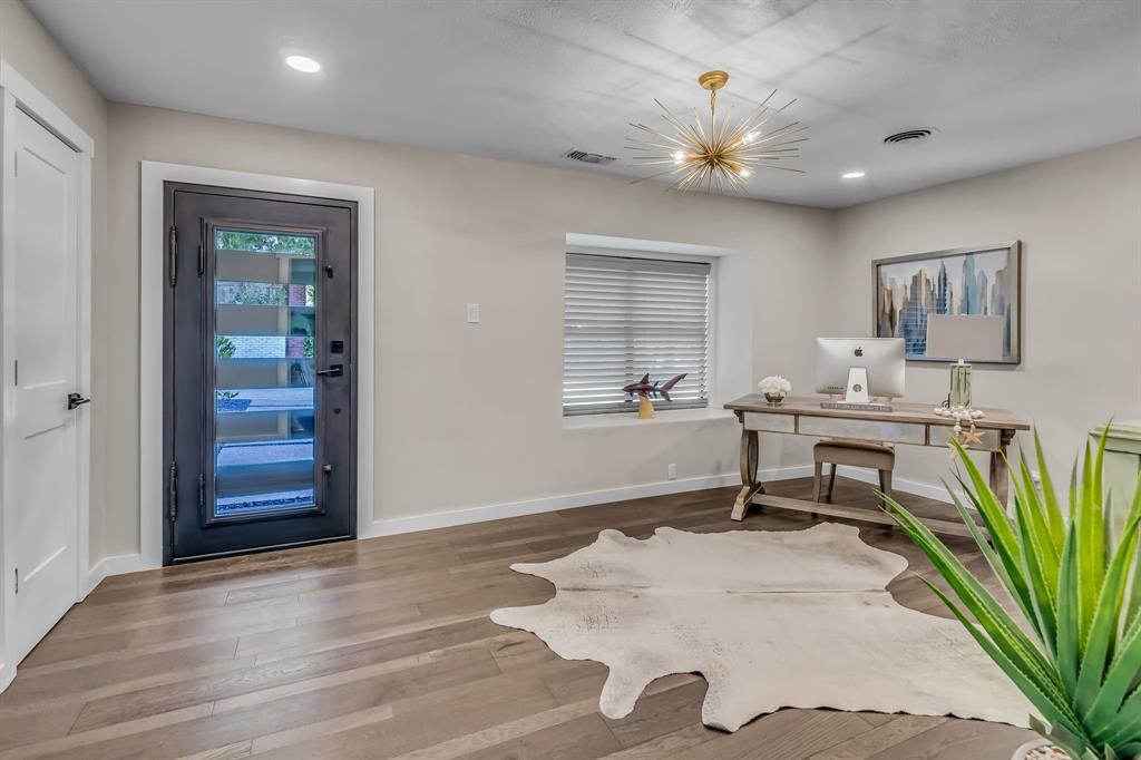 3449 West T Parr Road Grapevine, TX 76051 - Photo 6 of 32 a workspace with wooden floor and a chandelier