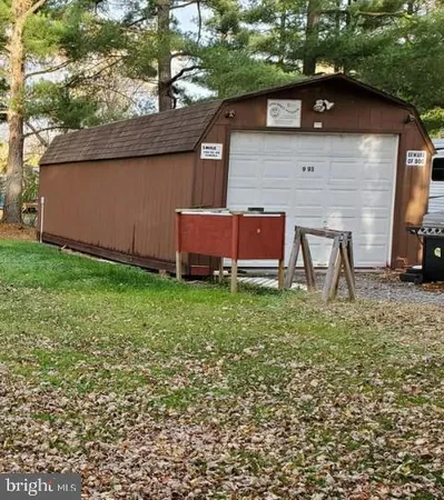 a view of a backyard with table and chairs