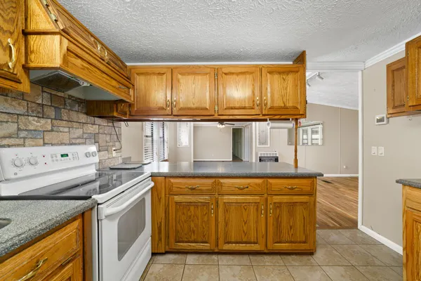 a view of a room wooden floor and a ceiling fan