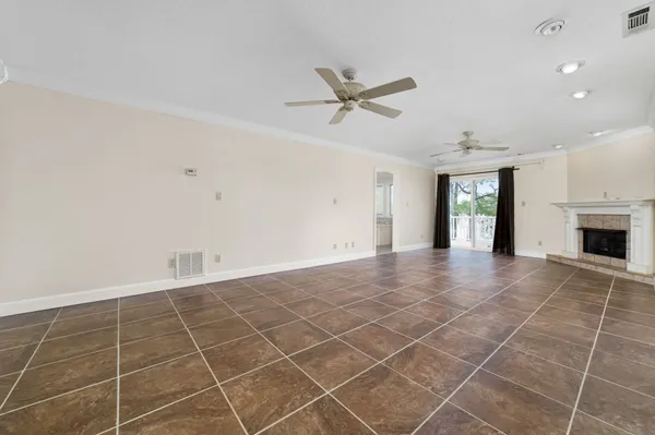 a view of an empty room with a fireplace