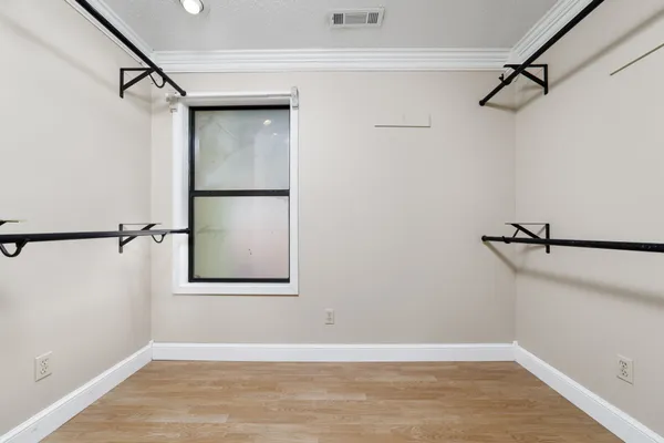 a view of a kitchen with cabinet and entryway