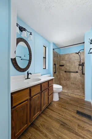 a bathroom with a toilet and a sink