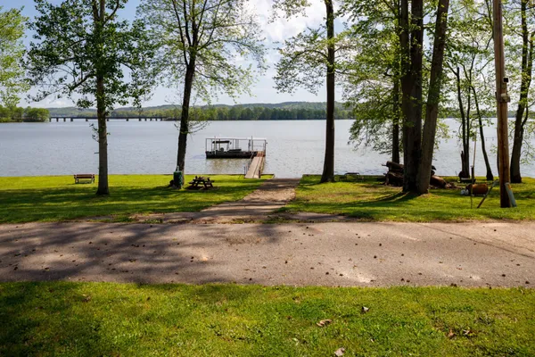 a view of a lake with houses in the back