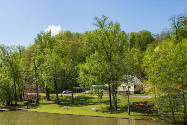 a view of a fountain in front of a house