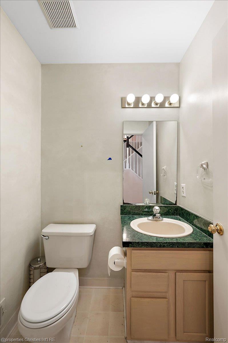 955 Rikki Ann Court Wixom, MI 48393 - Photo 36 of 54 Bathroom featuring vanity and toilet