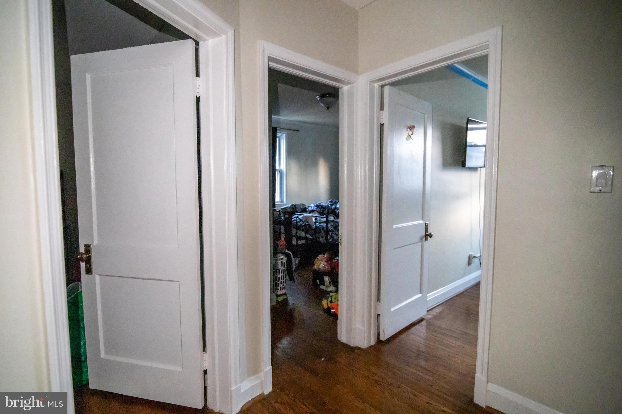 1649 Ralworth Road Baltimore, MD 21218 - Photo 18 of 47 a view of a hallway with wooden floor and closet