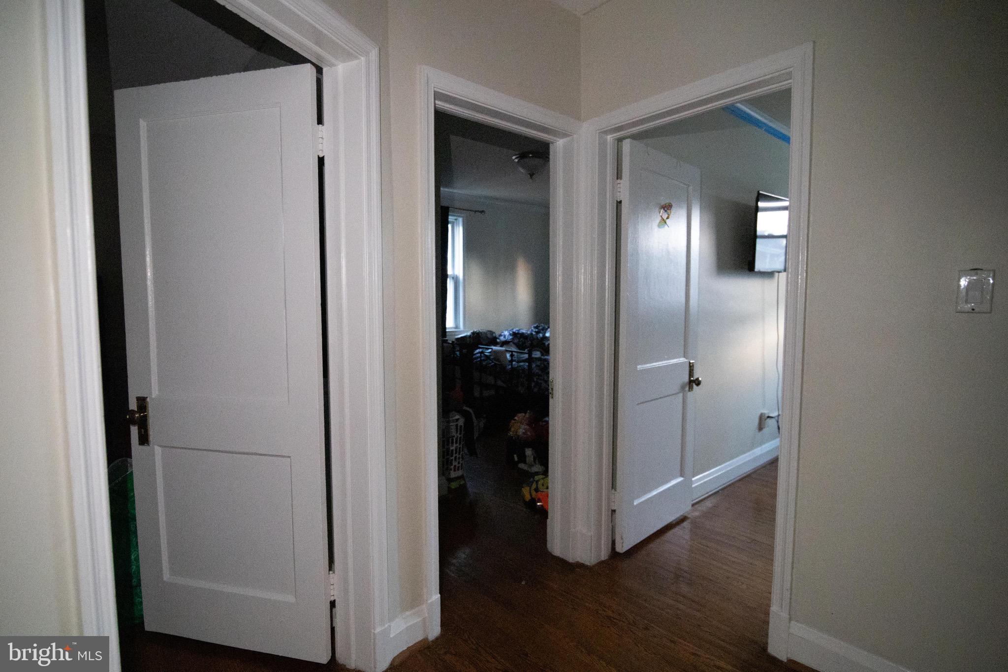 1649 Ralworth Road Baltimore, MD 21218 - Photo 19 of 47 a view of a hallway with wooden floor and closet