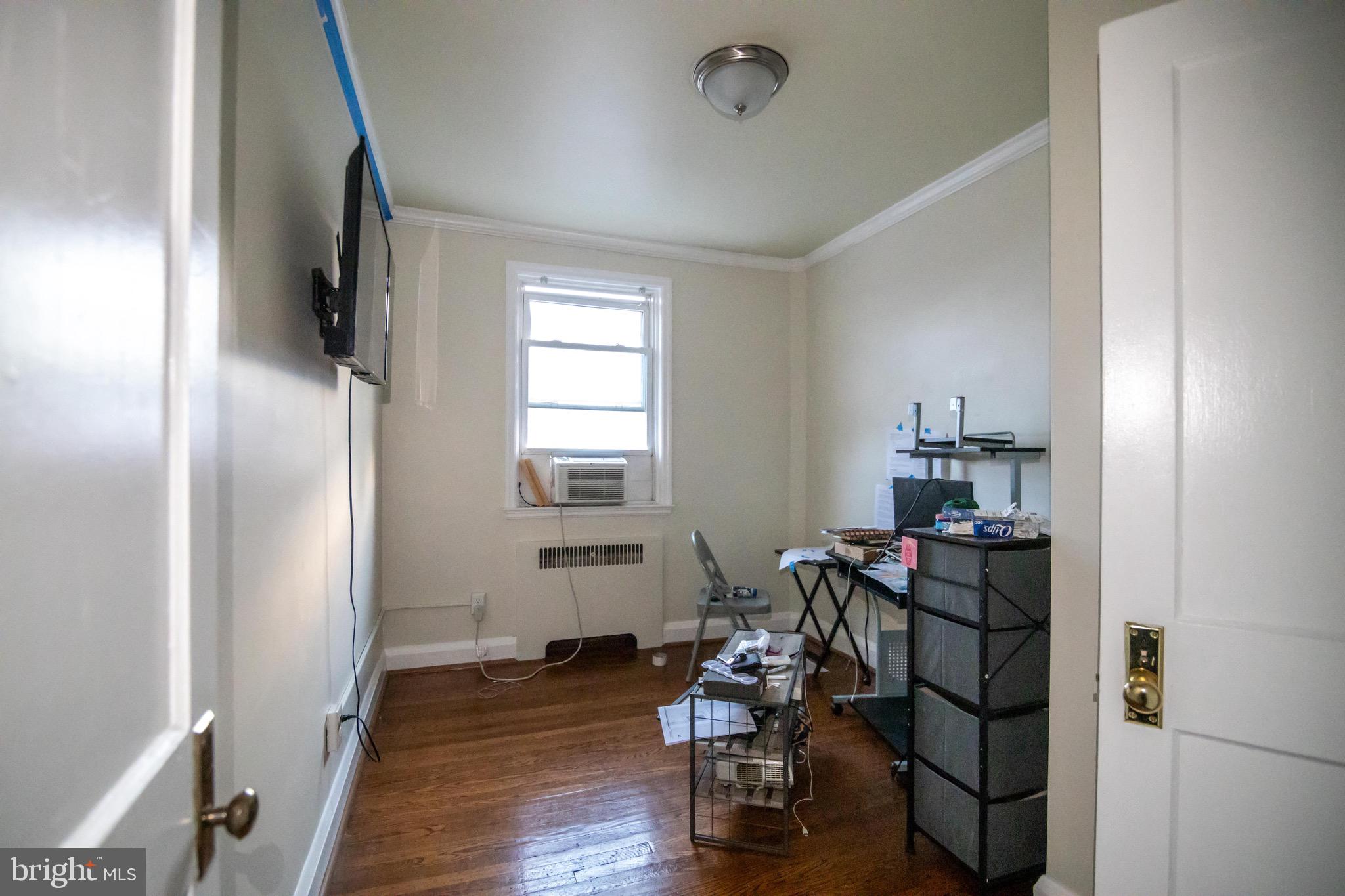 1649 Ralworth Road Baltimore, MD 21218 - Photo 22 of 47 a room with furniture and wooden floor