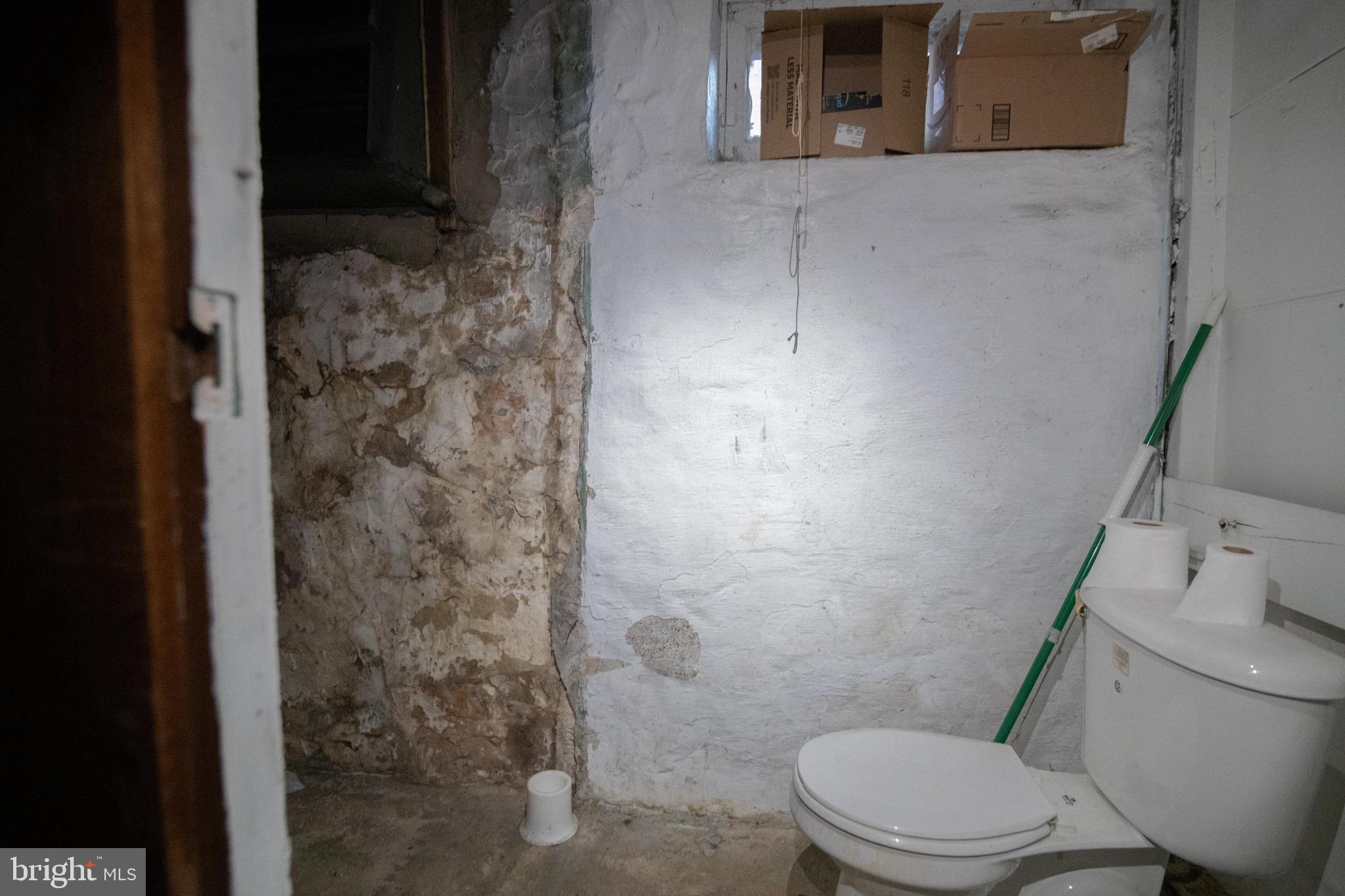 1649 Ralworth Road Baltimore, MD 21218 - Photo 26 of 47 a white toilet sitting next to a bathroom sink