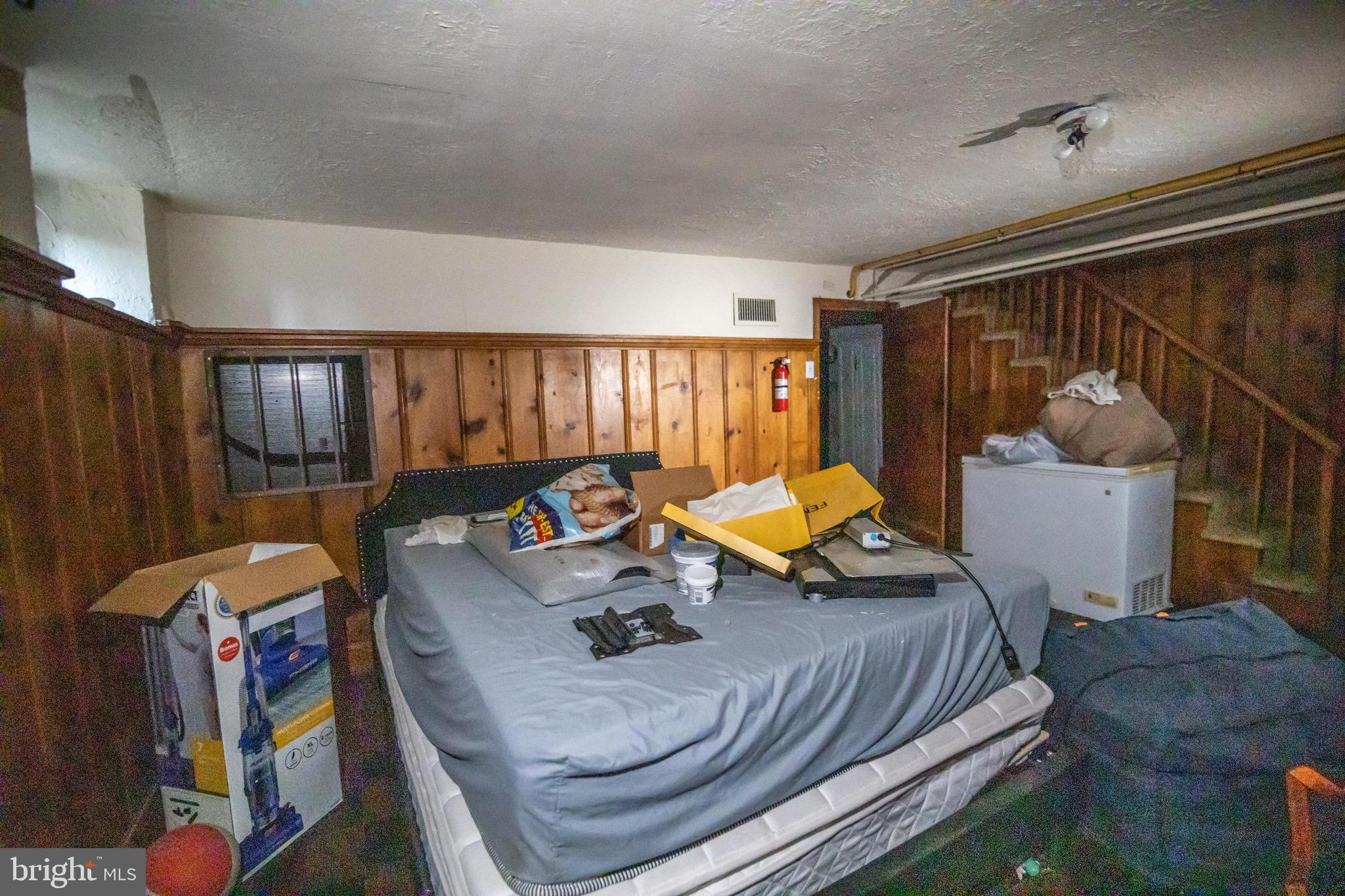 1649 Ralworth Road Baltimore, MD 21218 - Photo 30 of 47 a bed room with furniture and a window