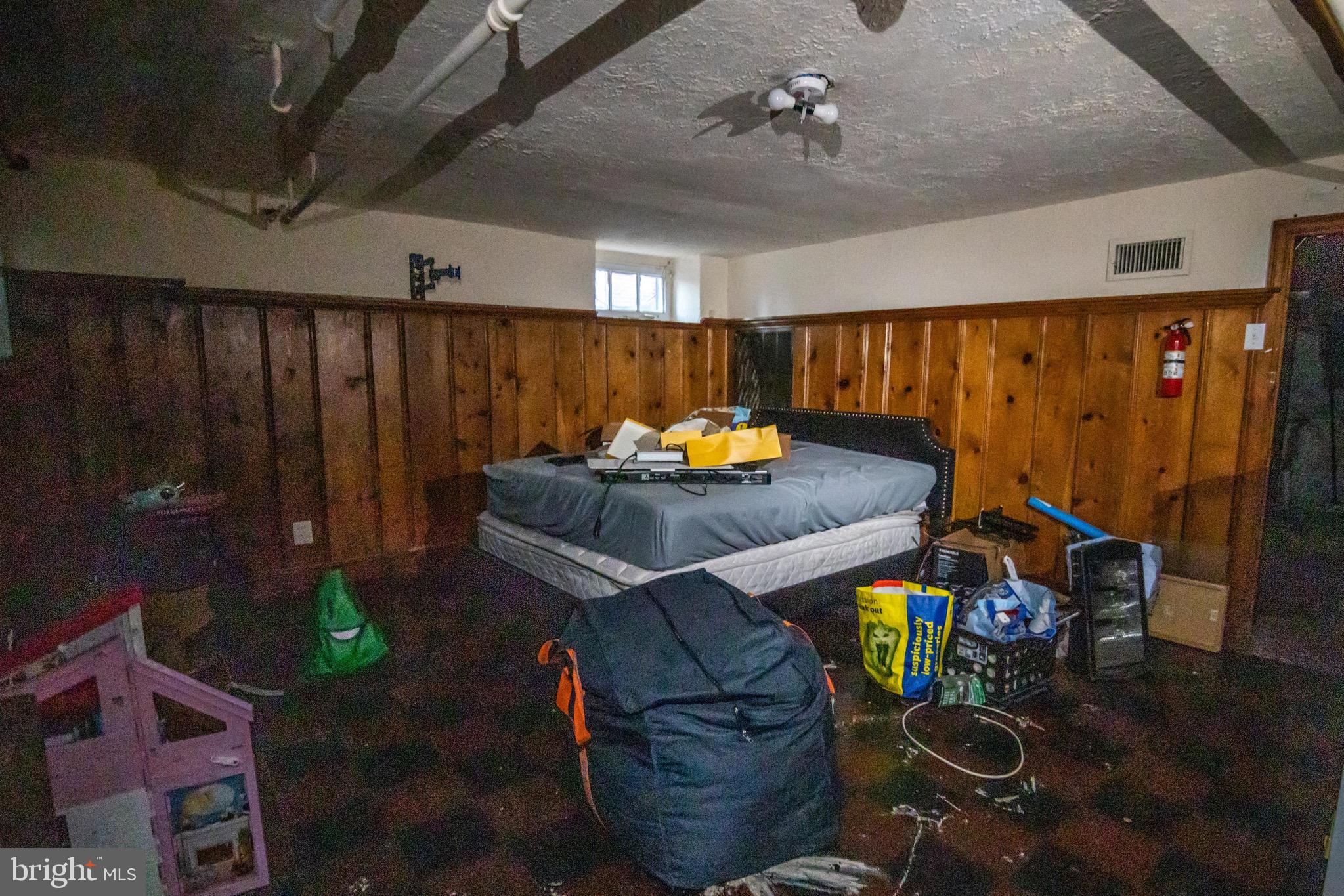 1649 Ralworth Road Baltimore, MD 21218 - Photo 31 of 47 a living room with furniture a rug and a chandelier