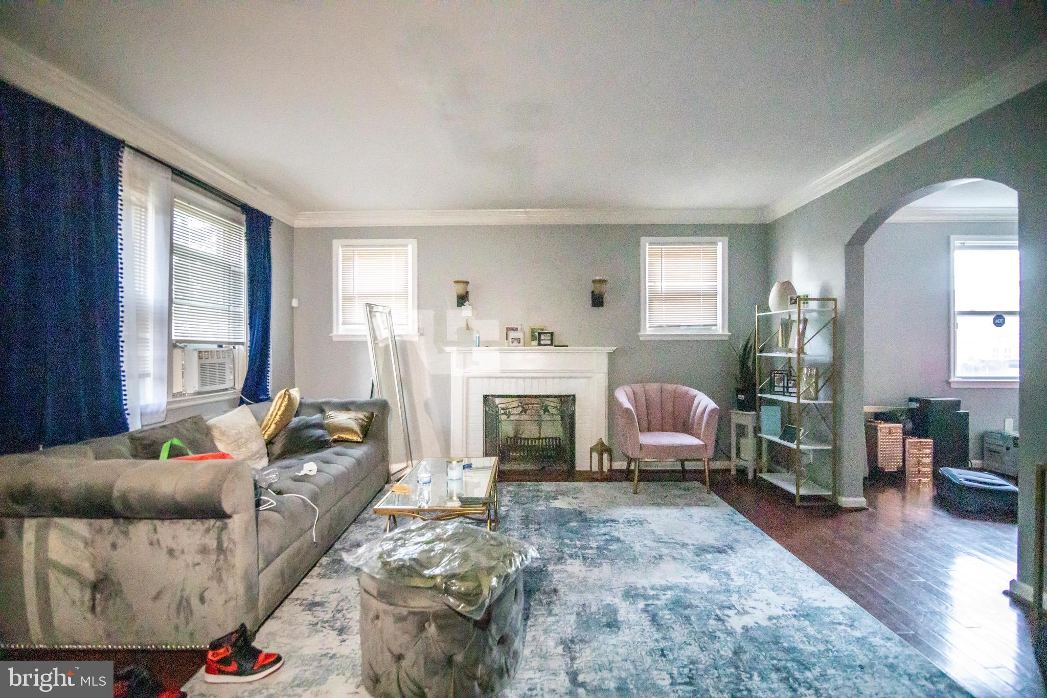 1649 Ralworth Road Baltimore, MD 21218 - Photo 34 of 47 a living room with furniture and a fireplace