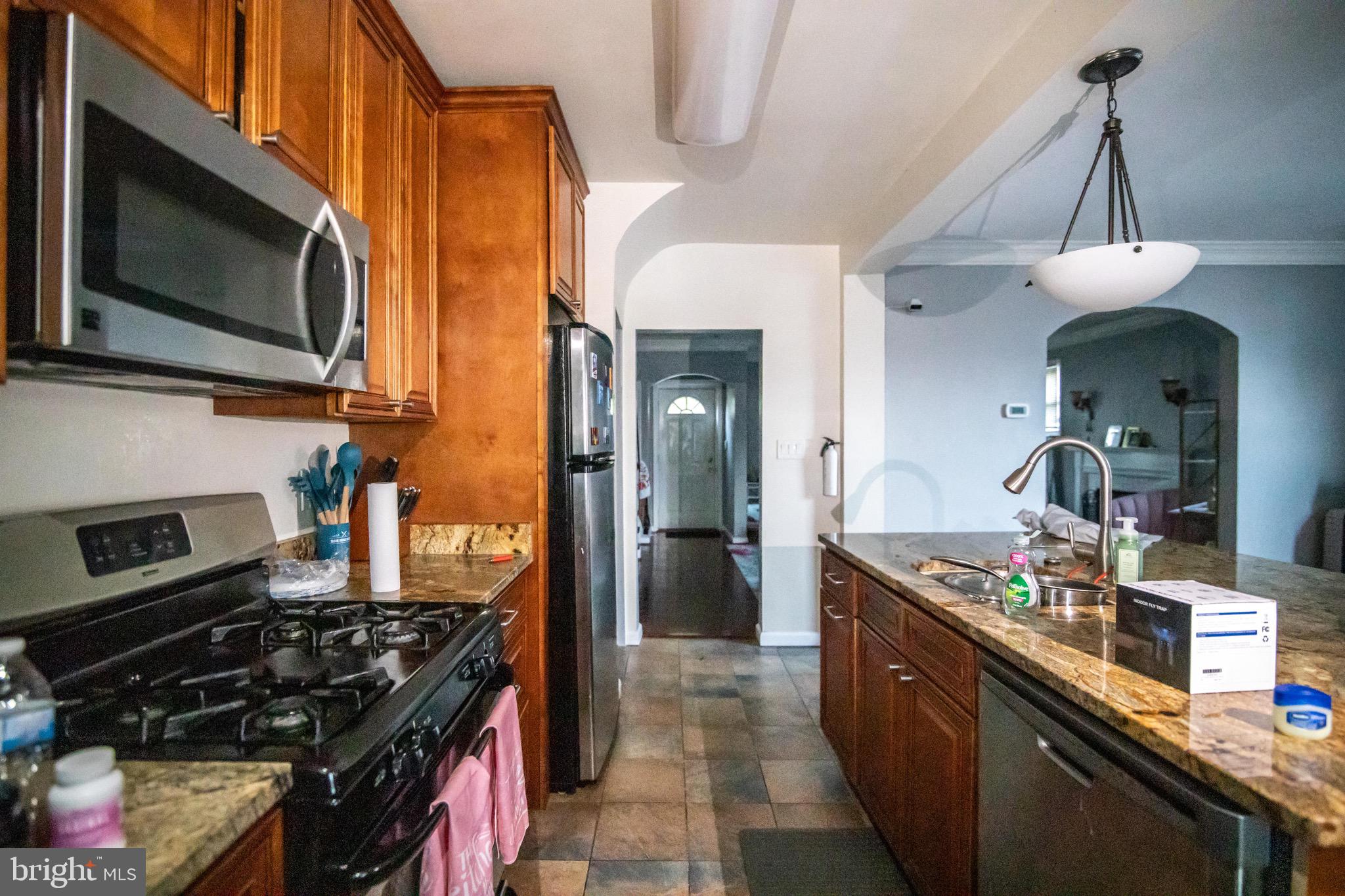 1649 Ralworth Road Baltimore, MD 21218 - Photo 5 of 47 a kitchen with stainless steel appliances granite countertop a stove and a sink